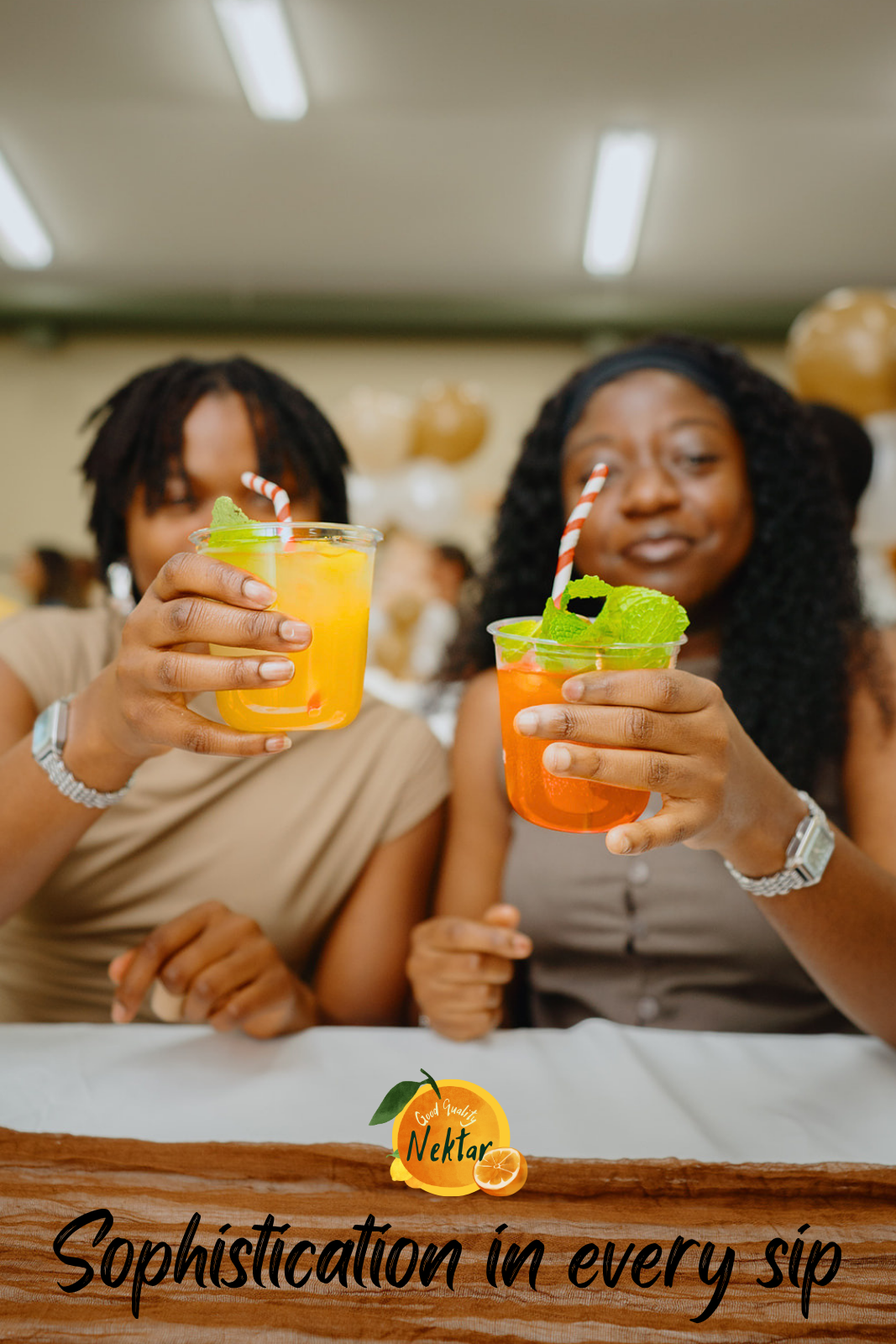 Two guests raising yellow and orange mocktails in a toast at a Nektar event